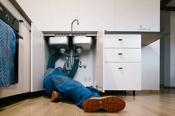 Professional Drain Cleaning technician working in Creston, IA